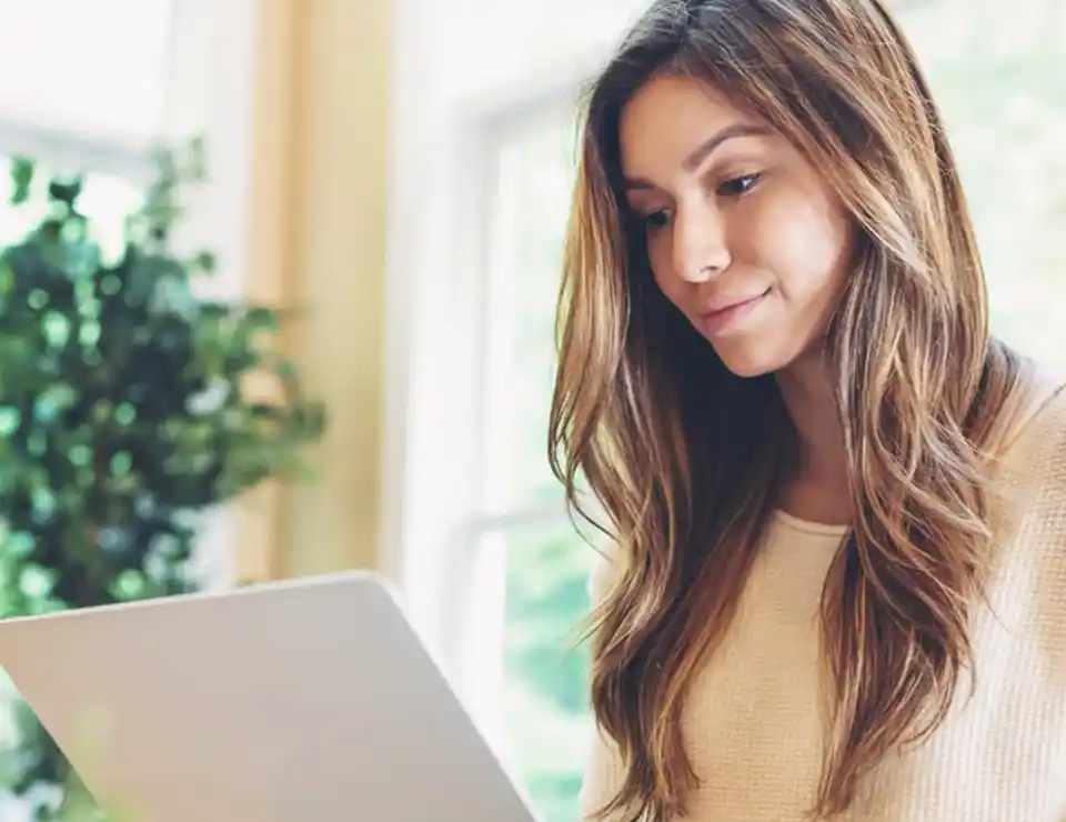 Woman reading on laptop